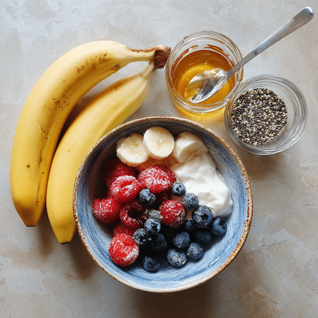 Ingredients for making 5-Minute Fruit Smoothie Bowl with yogurt, fruit, and honey