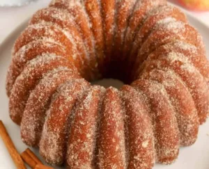 Apple Cider Donut Cake Quick and Surprisingly Light 3 Slice of Apple Cider Donut Cake on a wooden plate
