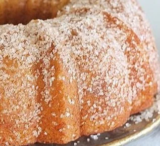 Delicious Apple Spice Bundt Cake served on a plate, garnished with cinnamon.