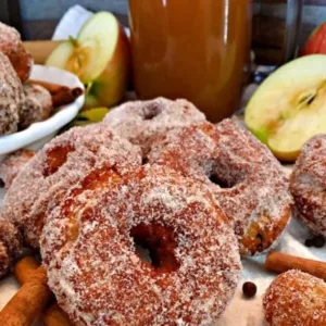 Crispy Fried Apple Cider Donuts 5 Plate of crispy fried apple cider donuts dusted with cinnamon sugar