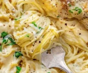 Crock Pot Angel Chicken dish ready to serve with herbs and spices