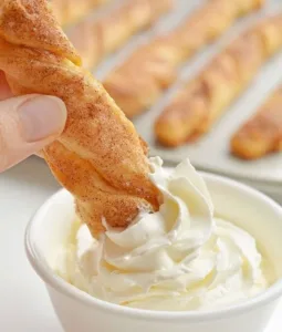 Easy Pumpkin Pie Twists 2 Easy pumpkin pie twists on a plate, garnished and ready to serve.