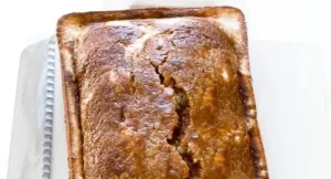 Pumpkin Cream Cheese Bread Recipe 5 Delicious pumpkin cream cheese bread loaf on a wooden cutting board