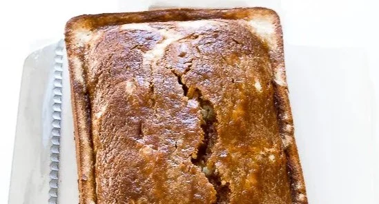 Pumpkin Cream Cheese Bread Recipe 2 Delicious pumpkin cream cheese bread loaf on a wooden cutting board