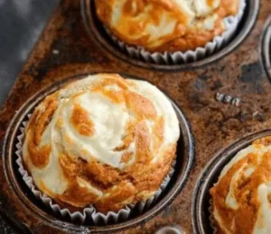 Pumpkin Cream Cheese Swirl Muffins 4 Pumpkin Cream Cheese Swirl Muffins fresh out of the oven