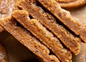 Pumpkin Snickerdoodle Cookies 4 Delicious Pumpkin Snickerdoodle cookies on a plate, perfect for fall baking.