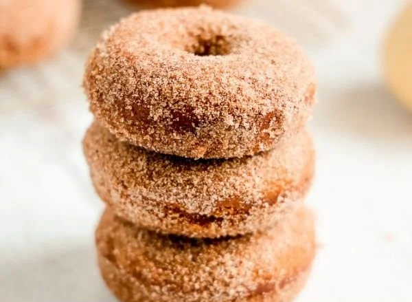 Pumpkin Spice Donuts Recipe 2 Homemade pumpkin spice donuts topped with glaze and cinnamon sugar
