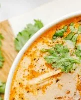 Bowl of creamy Slow Cooker Mexican Street Corn Soup topped with cilantro and cheese