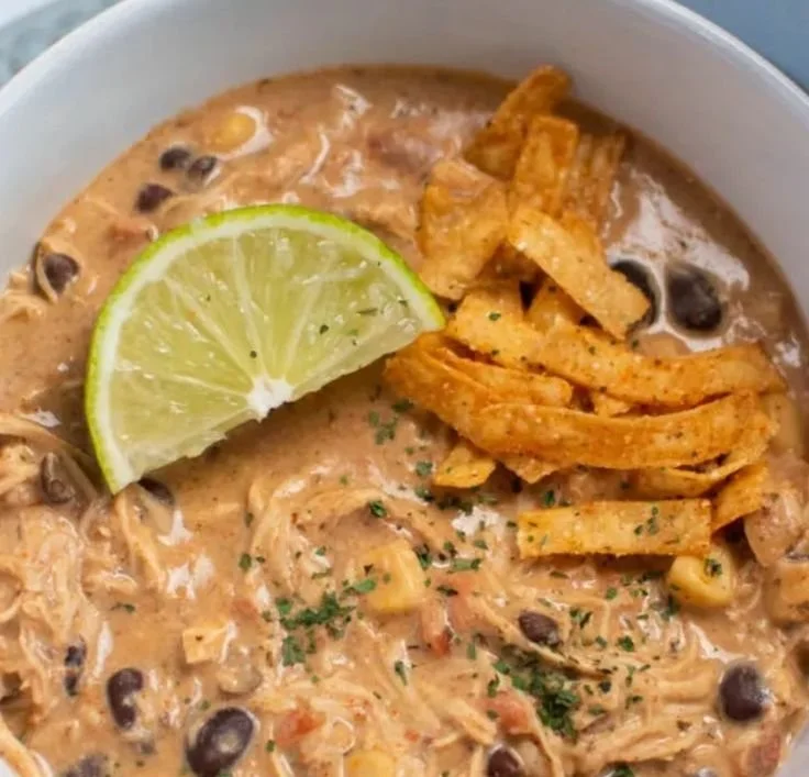 Bowl of creamy slow cooker white chicken chili with cream cheese