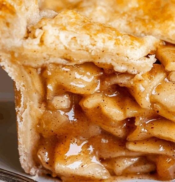 Delicious homemade apple pie topped with golden crust and cinnamon sugar.