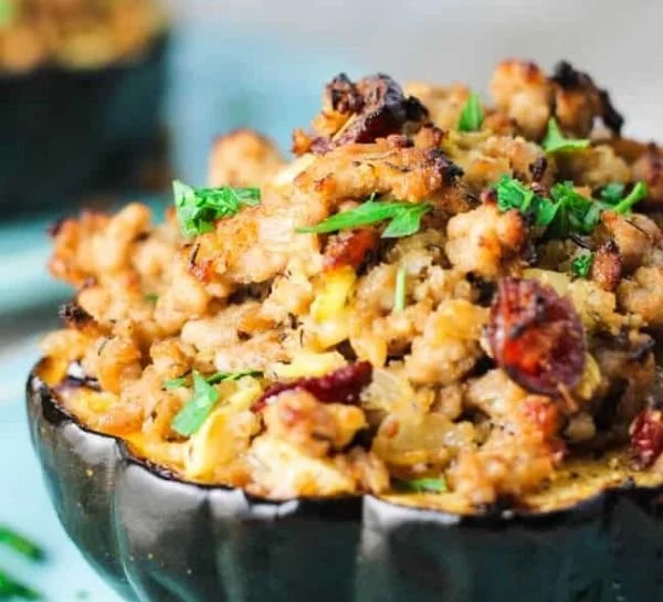 Home Loinzou 3 Turkey stuffed acorn squash garnished and ready to serve