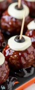 25 Quick Halloween Appetizers To Make 5 A platter of spooky Halloween appetizers like ghost-shaped cheese and mini pumpkin dips.