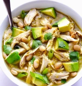 5-Ingredient Easy White Chicken Chili 4 Bowl of 5-ingredient easy white chicken chili topped with cilantro