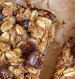 Banana Oatmeal Bars 2 Delicious homemade banana oatmeal bars on a wooden table
