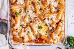 Delicious beef baked rigatoni casserole topped with melted cheese