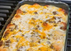 Biscuits and Gravy Breakfast Casserole Easy and Creamy 5 Easy creamy Biscuits and Gravy Breakfast Casserole served on a plate