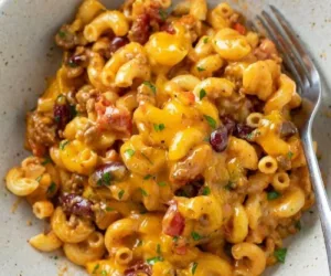 Chili Mac and Cheese 3 A hearty bowl of Chili Mac and Cheese topped with cheese and herbs
