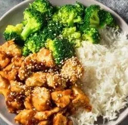 Delicious Dump-and-Go Crockpot Teriyaki Chicken served with rice and vegetables