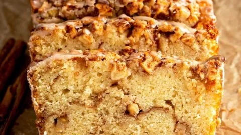 Easy Cinnamon Apple Bread 2 Sliced easy cinnamon apple bread on a plate with cinnamon sticks