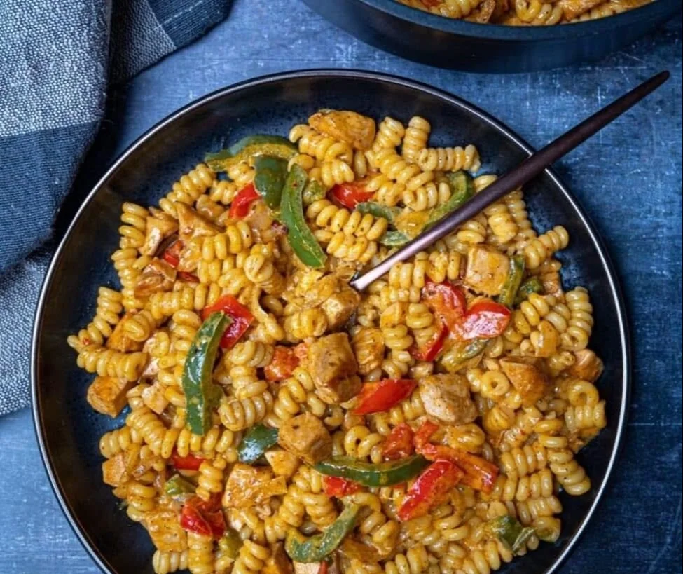 Easy Creamy Chicken Fajita Pasta 2 Delicious creamy chicken fajita pasta served in a bowl with colorful peppers