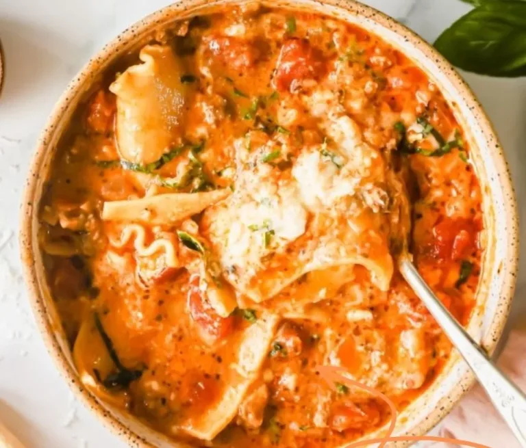 Bowl of easy creamy lasagna soup topped with cheese and herbs