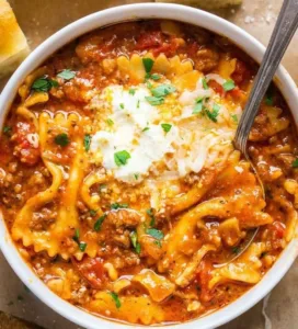 Lasagna Soup 6 A warm bowl of lasagna soup with noodles, cheese, and sauce