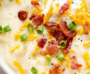 Loaded Potato Soup 5 Bowl of creamy Loaded Potato Soup topped with cheese, bacon, and green onions.