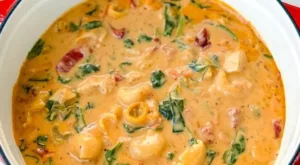 Marry Me Tuscan Chicken Soup 6 Delicious Marry Me Tuscan Chicken Soup garnished with fresh herbs.
