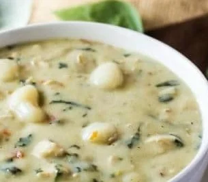 Olive Garden Chicken Gnocchi Soup 2 Bowl of Olive Garden-inspired Chicken Gnocchi Soup with herbs and vegetables