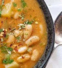 Potato and Bean Soup 6 Bowl of hearty Potato and Bean Soup garnished with herbs