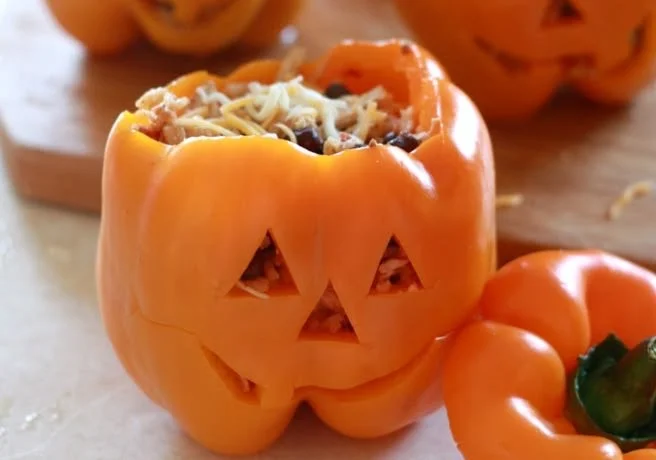 Shredded Chicken & Rice Stuffed Peppers (Halloween Style) 2 Halloween-style stuffed peppers with shredded chicken and rice