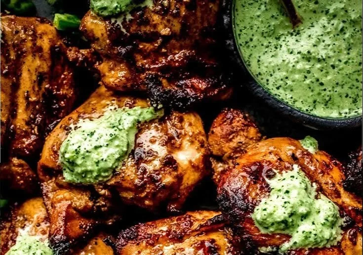 Simple Peruvian Grilled Chicken with Creamy Green Sauce 2 Delicious Peruvian grilled chicken served with creamy green sauce on a plate