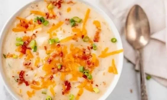 Slow Cooker Loaded Potato Soup: Perfect Snow Day Comfort Food 2 Bowl of slow cooker loaded potato soup topped with cheese and green onions