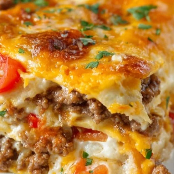 Taco Lasagna 2 Delicious homemade Taco Lasagna layered with cheese, ground beef, and taco seasoning