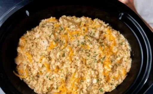 Creamy chicken and rice dish prepared in a slow cooker for a perfect meal.
