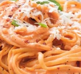 Creamy tomato pasta sauce with cream cheese served over spaghetti noodles