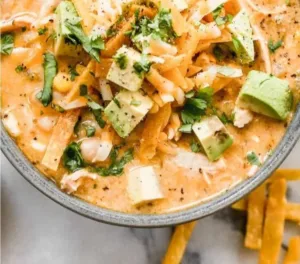 White Chicken Chili Easy and Creamy 5 Bowl of creamy white chicken chili garnished with cilantro