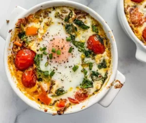 Baked feta eggs with herbs and spices in a cozy breakfast setting