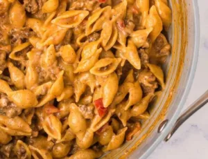 Cheesy Taco Pasta Recipe: Quick One Pot Meal | Dinner ideas no vegetables, Quick and easy pasta dinners, Recipes without chicken 6 Cheesy taco pasta served in a bowl, a quick one pot meal recipe.