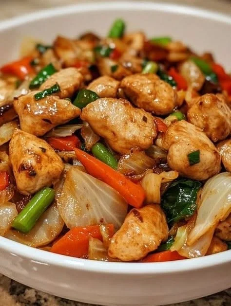 Home Loinzou 7 Delicious Chicken Cabbage Stir-Fry served in a bowl with colorful vegetables