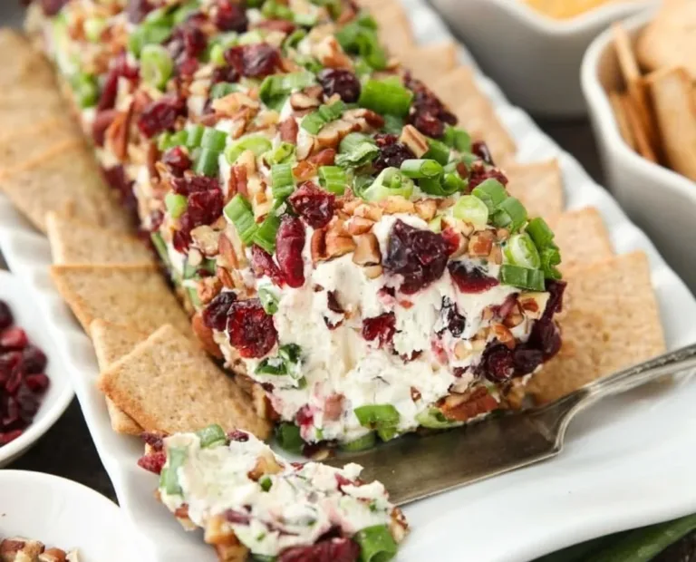 Cranberry cheese ball with pecans and cream cheese, a festive appetizer