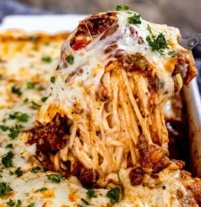 Deliciously cheesy and meaty baked spaghetti dish ready to serve