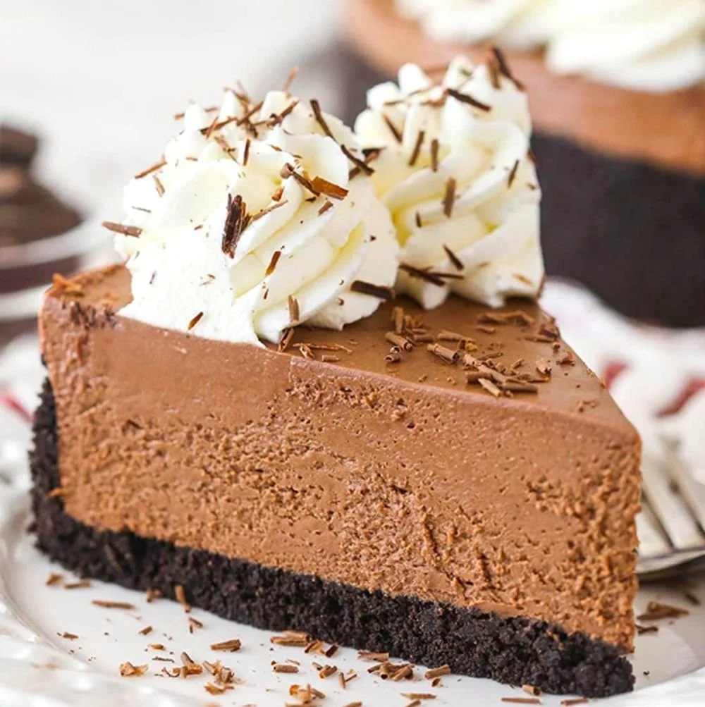 Easy No-Bake Chocolate Cheesecake Recipe 2 Easy no-bake chocolate cheesecake topped with chocolate shavings on a plate