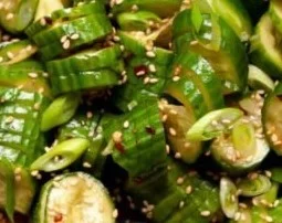 A bowl of Easy Spicy Cucumber Salad with vibrant vegetables and spices