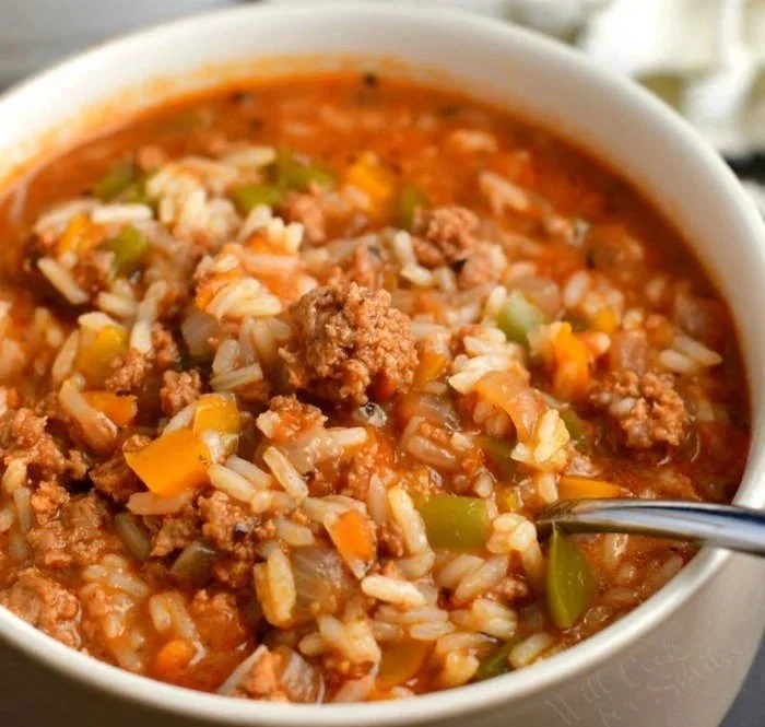Delicious bowl of easy stuffed peppers soup garnished with herbs